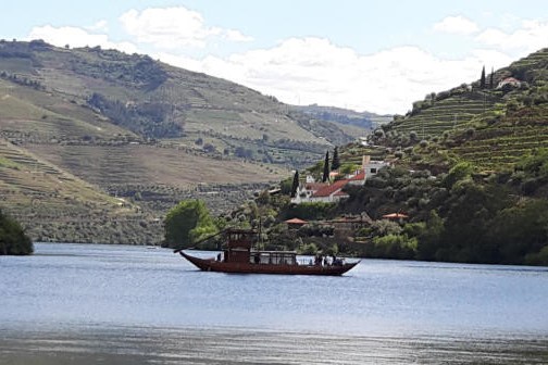 Boat in a river under a valley