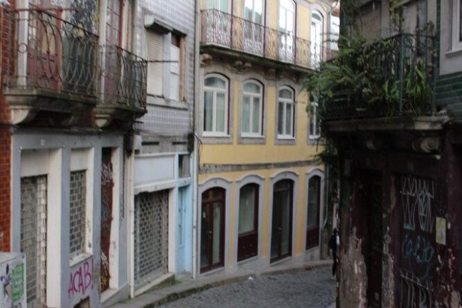 a close up of a street in front of a brick building