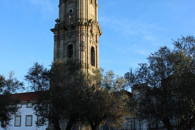 a large clock tower in front of a building