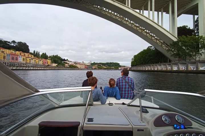 a group of people on a bridge over a body of water